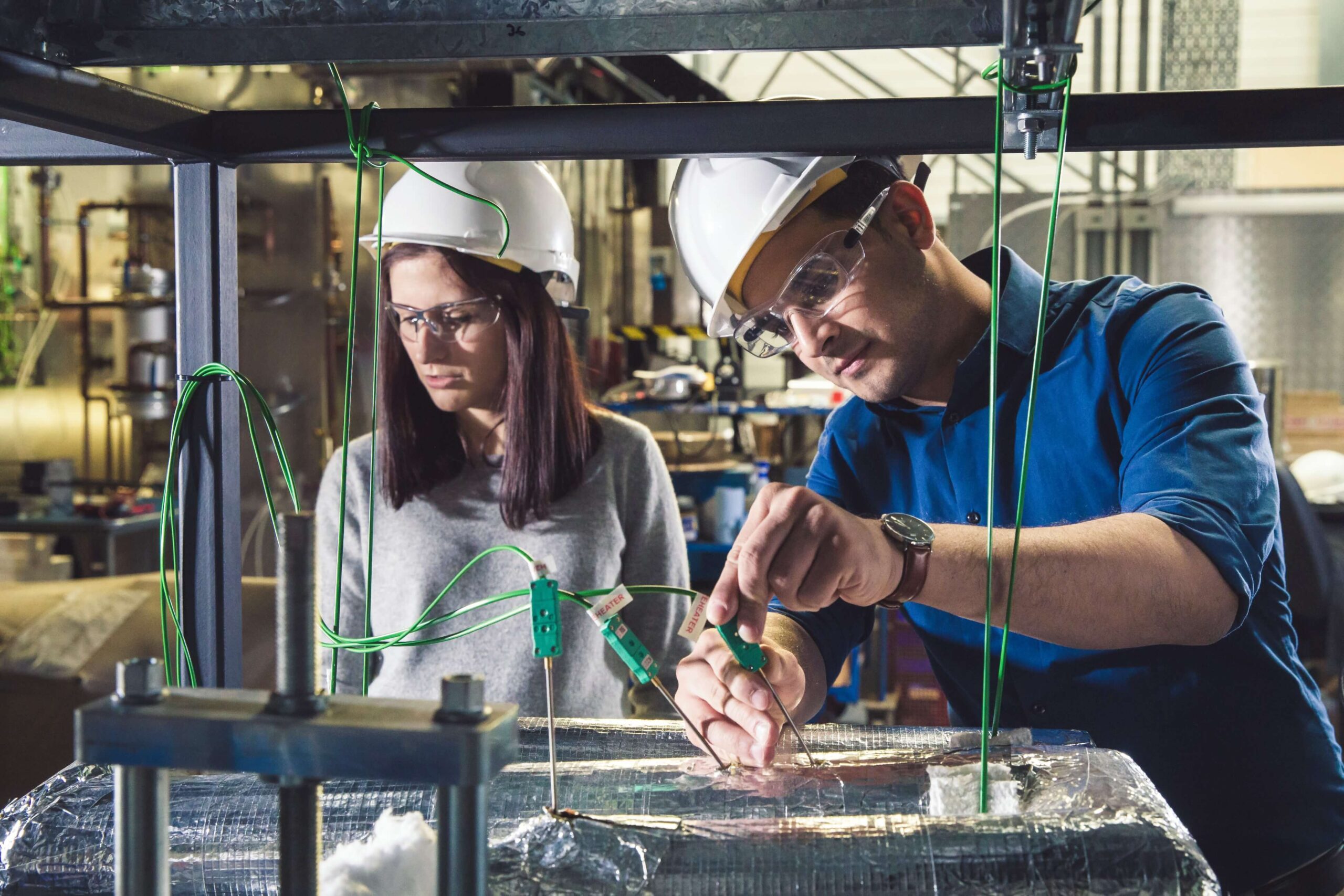 Two lab technicians working in a lab